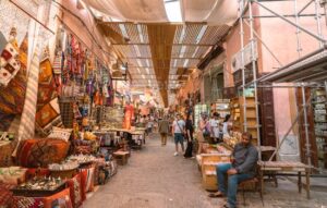 Explore the vibrant colors and lively atmosphere of a Marrakech souk, showcasing traditional crafts and local culture.